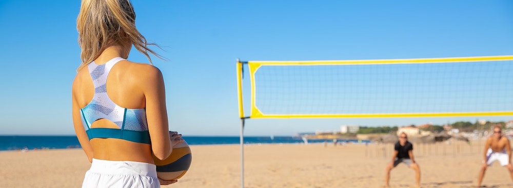 Playing beach volleyball in the sun