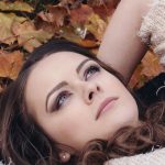 Girl in autumn with changing leaves