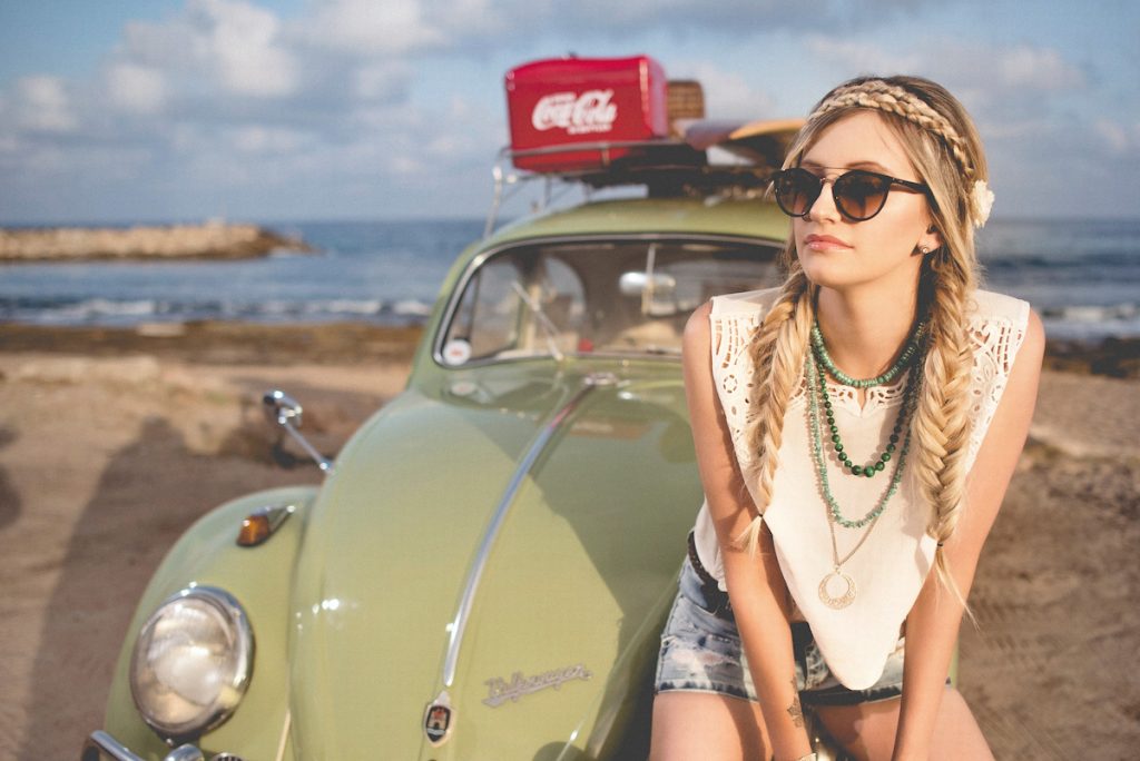 A girl with sunglasses on the beach