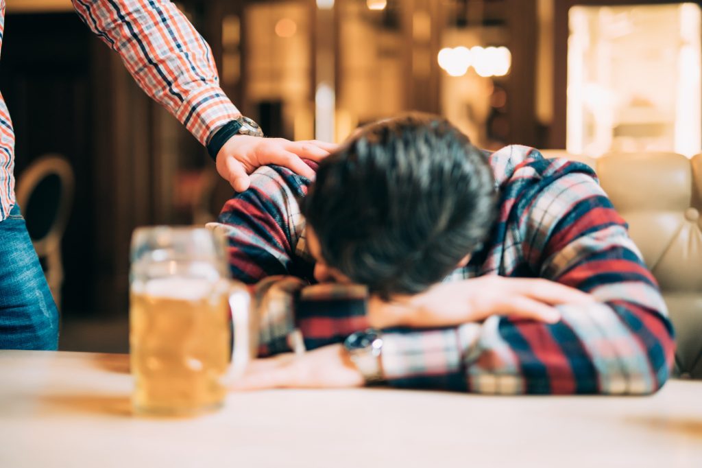 Drunk man in a craft beer bar